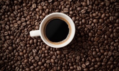 Fototapeta premium Aerial View of Hot Black Coffee Cup Surrounded by Roasted Beans