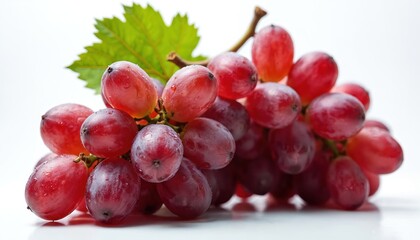 Fototapeta premium Close-up bunch ripe red grapes with leaf on white background. Fresh healthy organic fruit perfect for wine, juice, dessert, vegan, vegetarian diet. Summer harvest, rich vitamin source. Food