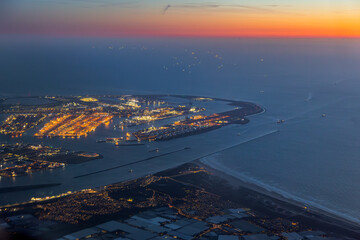 Aerial night view of Port of Rotterdam terminal and shipping lanes