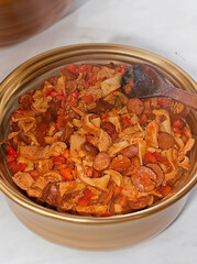 Traditional rustic Brazilian food known as dobradinha  prepared with beef tripe, white beans and classic seasonings in a rustic setting