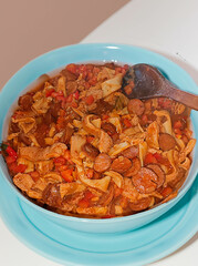 Traditional rustic Brazilian food known as dobradinha  prepared with beef tripe, white beans and classic seasonings in a rustic setting