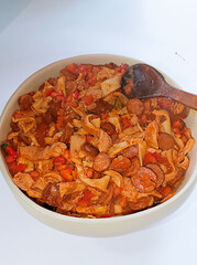 Traditional rustic Brazilian food known as dobradinha  prepared with beef tripe, white beans and classic seasonings in a rustic setting