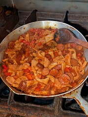 Traditional rustic Brazilian food known as dobradinha  prepared with beef tripe, white beans and classic seasonings in a rustic setting