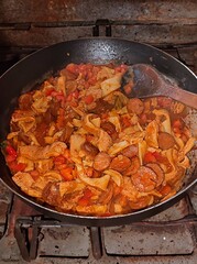 Traditional rustic Brazilian food known as dobradinha  prepared with beef tripe, white beans and classic seasonings in a rustic setting