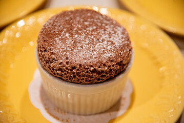 Chocolate cake on a yellow plate