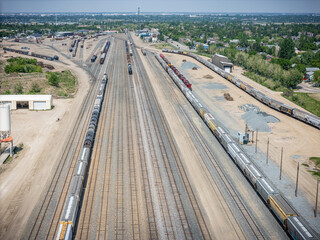 Train track with many trains on it