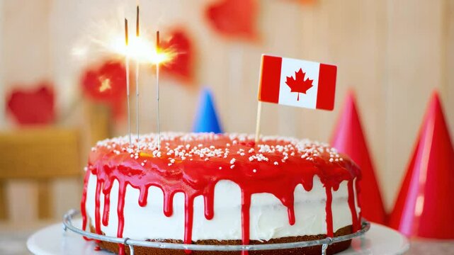 Festive cake with red and white glaze, Canadian flag and sparklers on top, party hats and decorations in background, Canada Day celebration, national holiday, patriotic dessert