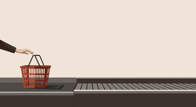 Hand placing shopping basket on checkout conveyor