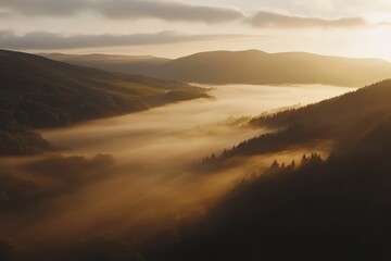 Fototapeta premium Sunrise mist over valley and hills.