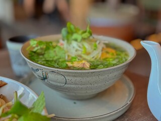 Vibrant Green Noodle Soup with Fresh Herbs