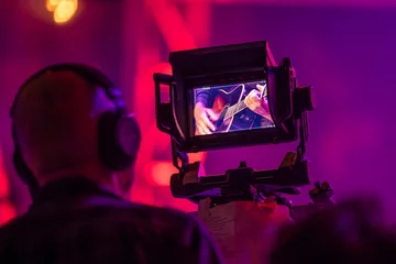Viewfinder of TV camera at a live concert, framing a closeup shot of a guitar © Michael v Aichberger