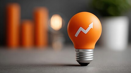 Bright Idea for Growth: Orange Light Bulb with Upward Trend Graphic, Symbolizing Innovation and Success in Business and Finance.