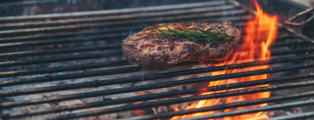 Banner BBQ Barbecue grilled meat stick on fire flame hot charcoal cooking outdoor. Banner Beef grilling picnic rib smoke bacon american cuisine. Grill pork heat bbq rack fire flame with copy space