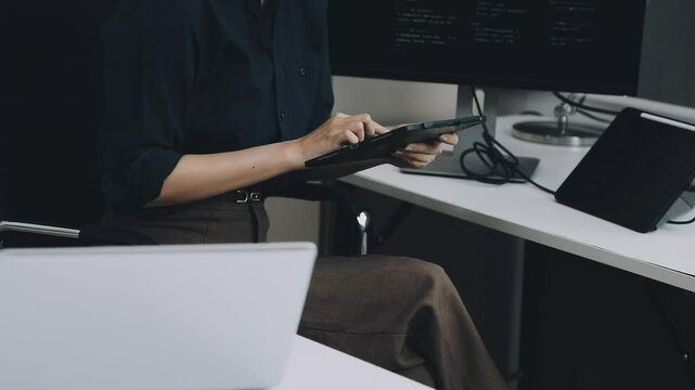 Two asian team working development of programming and encryption technology website design programmers on desk in office