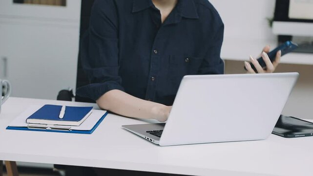 Two asian team working development of programming and encryption technology website design programmers on desk in office