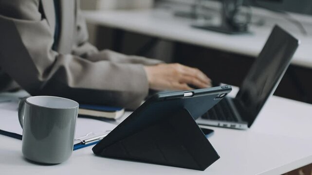 Two asian team working development of programming and encryption technology website design programmers on desk in office