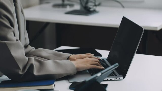 Two asian team working development of programming and encryption technology website design programmers on desk in office
