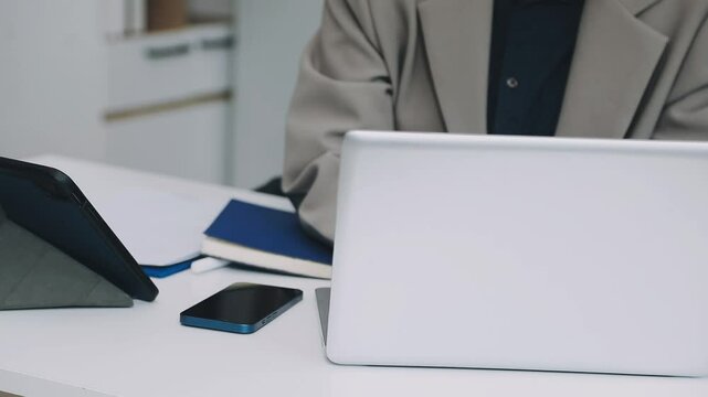 Two asian team working development of programming and encryption technology website design programmers on desk in office