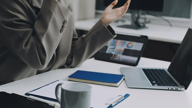 Two asian team working development of programming and encryption technology website design programmers on desk in office