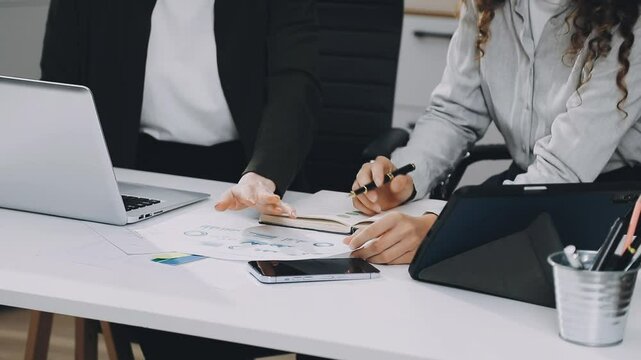 Two asian team working development of programming and encryption technology website design programmers on desk in office