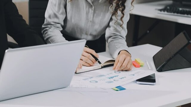 Two asian team working development of programming and encryption technology website design programmers on desk in office