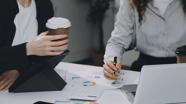 Two asian team working development of programming and encryption technology website design programmers on desk in office