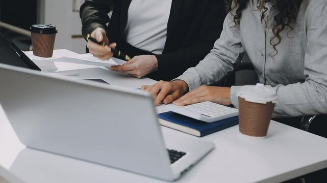 Two asian team working development of programming and encryption technology website design programmers on desk in office