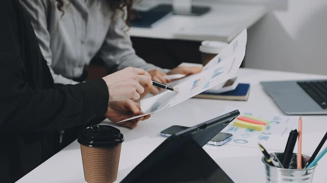 Two asian team working development of programming and encryption technology website design programmers on desk in office
