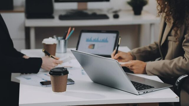 Two asian team working development of programming and encryption technology website design programmers on desk in office