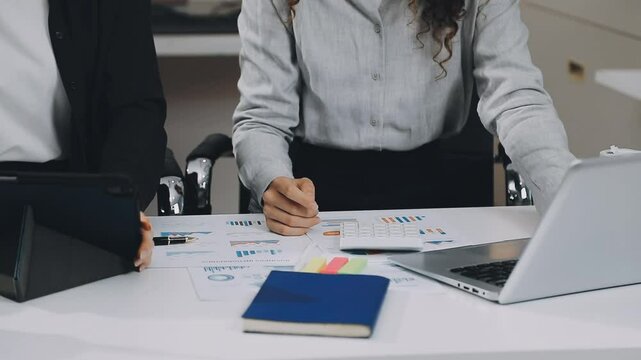 Two asian team working development of programming and encryption technology website design programmers on desk in office