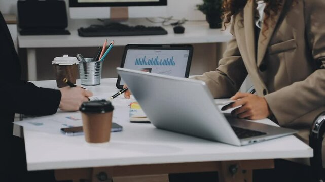 Two asian team working development of programming and encryption technology website design programmers on desk in office
