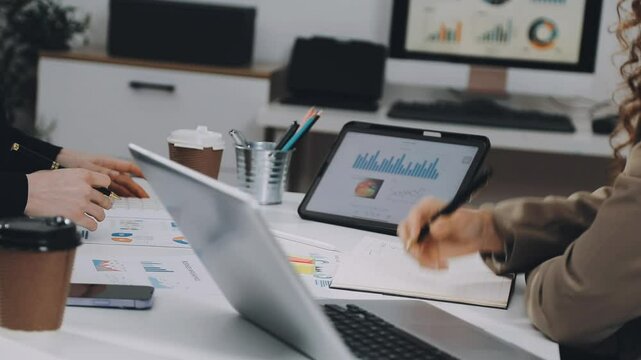 Two asian team working development of programming and encryption technology website design programmers on desk in office