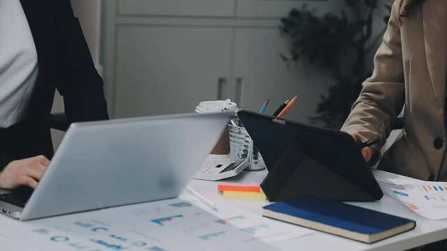 Two asian team working development of programming and encryption technology website design programmers on desk in office