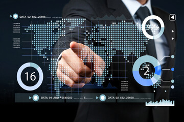 Businessman Interacting with Digital Data Visualization on Touchscreen Display in Modern Office Environment and Global Map Background