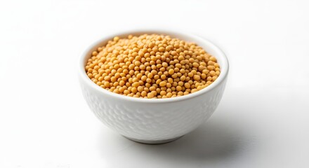 A close up of a white bowl filled with yellow seeds sitting on a white background