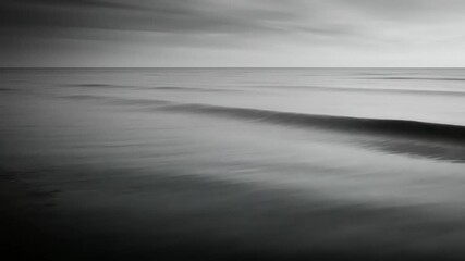 Gray monochrome seascape with gentle waves - Powered by Adobe