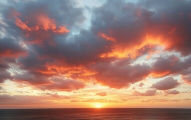 Obraz premium Vibrant sunset over the ocean with dramatic clouds illuminated in orange and pink hues creating a peaceful and awe-inspiring atmosphere