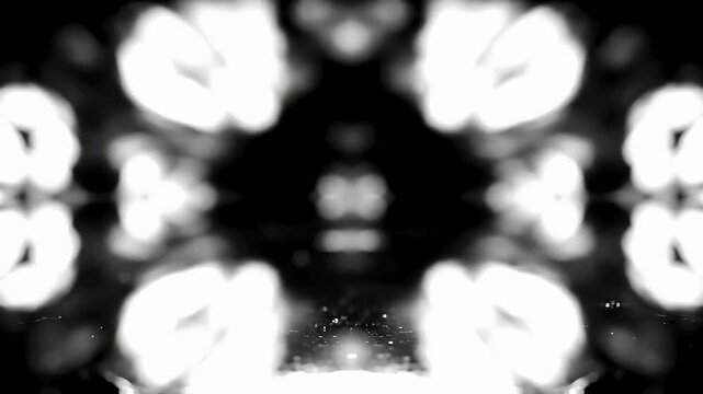 Abstract of  Fluid ink-like shapes spread across a mirrored surface, constantly evolving in symmetrical patterns that reflect Rorschach test visuals.
