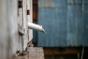 Background of water pipes protruding from the walls of old buildings
