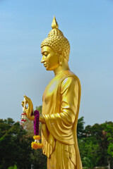  The Golden Buddha statue is a sacred symbol of Buddhism and  general attraction in peaceful Thailand.