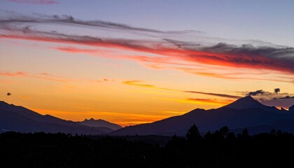 Obraz premium Colorful sunset over mountains