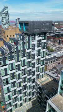Aerial View of Historical and Modern Central Town Center and Downtown Buildings at British City Centre of Liverpool, Maritime city in northwest England, United Kingdom on Beach and Ocean Docks.