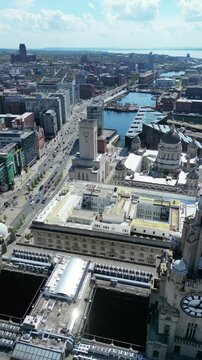 Aerial View of Historical and Modern Central Town Center and Downtown Buildings at British City Centre of Liverpool, Maritime city in northwest England, United Kingdom on Beach and Ocean Docks.