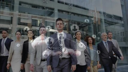 Business team walking at glass office, gesturing forming network around leader showing connectivity - Powered by Adobe