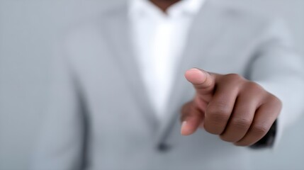 Confident businessman pointing directly at the camera