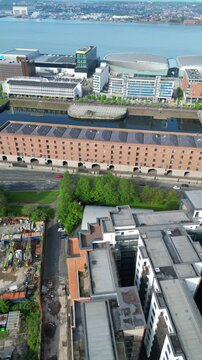 Aerial View of Historical and Modern Central Town Center and Downtown Buildings at British City Centre of Liverpool, Maritime city in northwest England, United Kingdom on Beach and Ocean Docks.