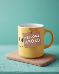 Modern Workplace Onboarding Yellow Smiley Mug with Welcome Aboard Note on Wooden Board for Positive HR Integration and Corporate Culture