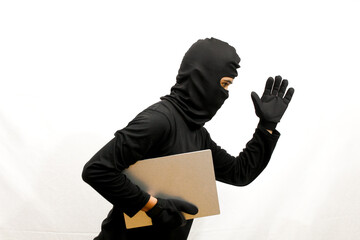thief stealing laptop computer isolated white background .criminal concept