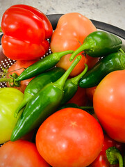 small garden harvest with tomatoes and jalapeño peppers