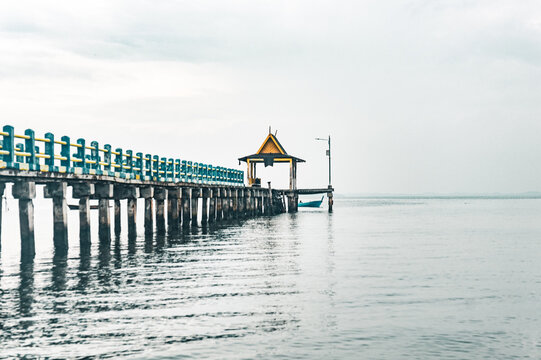 Fototapeta old wooden pier in the sea